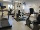 Fully equipped fitness center with treadmills, elliptical, weight machine, and stationary bike for residents at 5905 S Kings Hwy. # 206A, Myrtle Beach, SC 29575