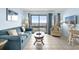 Comfortable living room with ocean views and access to the balcony at 5905 S Kings Hwy. # 206A, Myrtle Beach, SC 29575