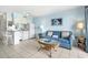 Cozy living room with a comfortable sofa and adjacent kitchen, creating an inviting and functional space at 5905 S Kings Hwy. # 206A, Myrtle Beach, SC 29575
