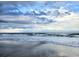 Serene ocean view showcasing waves and sand, perfect for enjoying the peaceful coastal scenery at 5905 S Kings Hwy. # 206A, Myrtle Beach, SC 29575
