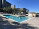 Outdoor pool with lounge chairs and palm trees, offering a refreshing escape at 5905 S Kings Hwy. # 206A, Myrtle Beach, SC 29575