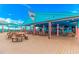 The Quarterdeck restaurant features an open-air dining area with picnic tables and a view of the ocean at 5905 S Kings Hwy. # 206A, Myrtle Beach, SC 29575