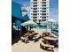 The Quarterdeck restaurant has outdoor seating with umbrellas and views of the adjacent building at 5905 S Kings Hwy. # 206A, Myrtle Beach, SC 29575