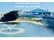 A charming Quarterdeck oceanfront restaurant with outdoor seating and a picturesque pond in front at 5905 S Kings Hwy. # 206A, Myrtle Beach, SC 29575