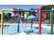 Colorful buckets and umbrellas at the splash pad with plenty of seating available at 5905 S Kings Hwy. # 206A, Myrtle Beach, SC 29575