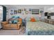 Cozy bedroom featuring a couch, queen bed with starfish bedding, and beach-themed decor at 5909 N Ocean Blvd. # 18, North Myrtle Beach, SC 29582