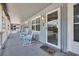 Outdoor porch with rocking chairs and serene views of the surrounding beach community at 5909 N Ocean Blvd. # 18, North Myrtle Beach, SC 29582