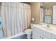 Clean bathroom with white vanity, coordinated towel set, and a shower with neutral toned curtain at 601 Hillside Dr. N # 1931, North Myrtle Beach, SC 29582