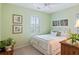 Bright bedroom features white bedding, ceiling fan, and bright natural light from the window at 601 Hillside Dr. N # 1931, North Myrtle Beach, SC 29582