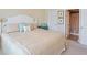 This bedroom features a bed with throw pillows and ensuite bathroom access at 601 Hillside Dr. N # 1931, North Myrtle Beach, SC 29582