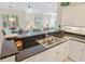 Modern kitchen with granite countertops, stainless steel sink, and open layout to the living area at 601 Hillside Dr. N # 1931, North Myrtle Beach, SC 29582