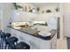 Well-equipped kitchen with granite countertops, bar stool seating, and bright white cabinetry at 601 Hillside Dr. N # 1931, North Myrtle Beach, SC 29582
