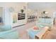 Inviting living area with an entertainment center, plush seating, and an open view to the dining area at 601 Hillside Dr. N # 1931, North Myrtle Beach, SC 29582
