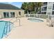 Community hot tub next to large pool and building with ample lounge chairs at 601 Hillside Dr. N # 1931, North Myrtle Beach, SC 29582