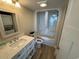 Compact bathroom with a shower-tub combo and a stackable washer and dryer unit at 601 Retreat Beach Circle # 521, Pawleys Island, SC 29585