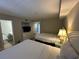 Inviting bedroom with comfortable beds and a view into the bathroom at 601 Retreat Beach Circle # 521, Pawleys Island, SC 29585