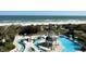 Beautiful aerial view of the pool with beach and ocean in the background at 601 Retreat Beach Circle # 521, Pawleys Island, SC 29585