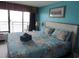 Bright bedroom with a queen-sized bed, balcony access, and lovely ocean view at 6804 N Ocean Blvd. # 1023, Myrtle Beach, SC 29572