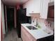 Functional kitchen with white cabinets, stainless steel sink, modern appliances, and tiled backsplash at 6804 N Ocean Blvd. # 1023, Myrtle Beach, SC 29572