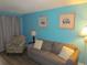Cozy living room features comfortable seating, stylish decor, and calming blue walls at 6804 N Ocean Blvd. # 1023, Myrtle Beach, SC 29572