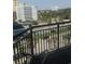 Balcony view overlooking parking area, buildings, and palm trees at 7100 North Ocean Blvd. # 617, Myrtle Beach, SC 29577