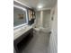 Well-lit bathroom featuring a modern vanity, and a shower-tub combo at 7100 North Ocean Blvd. # 617, Myrtle Beach, SC 29577