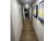 Hallway with neutral walls, sleek doors, and artwork on the wall at 7100 North Ocean Blvd. # 617, Myrtle Beach, SC 29577
