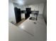 Well-lit kitchen showcasing white cabinetry, dark hardware, and modern black appliances at 7100 North Ocean Blvd. # 617, Myrtle Beach, SC 29577