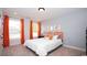 Cozy bedroom features a large window, grey walls, and decorative orange accents at 7180 Shooting Star Way, Myrtle Beach, SC 29579