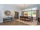 Elegant dining room features natural light, hardwood floors, and a stylish area rug at 7180 Shooting Star Way, Myrtle Beach, SC 29579