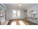Inviting entryway featuring elegant decor, hardwood flooring, and plenty of natural light at 7180 Shooting Star Way, Myrtle Beach, SC 29579