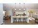 Open concept kitchen with an island, barstool seating, and stainless steel appliances at 7180 Shooting Star Way, Myrtle Beach, SC 29579