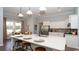 Kitchen with an island, barstool seating, and stainless steel appliances at 7180 Shooting Star Way, Myrtle Beach, SC 29579