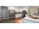 Bright kitchen featuring stainless steel appliances, white cabinets, and a stylish backsplash at 7180 Shooting Star Way, Myrtle Beach, SC 29579