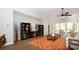 Comfortable living room featuring stylish shelving, decor, and a sliding glass door leading to an outdoor patio at 7180 Shooting Star Way, Myrtle Beach, SC 29579