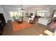 Open-concept living space with modern furnishings, hardwood flooring, and plenty of natural light at 7180 Shooting Star Way, Myrtle Beach, SC 29579