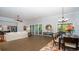 Spacious living room and dining area with hardwood floors, a comfortable sofa, and modern decor at 7180 Shooting Star Way, Myrtle Beach, SC 29579