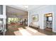 Bright, open-concept living room with hardwood floors, elegant decor, and a seamless flow to the outdoors at 7180 Shooting Star Way, Myrtle Beach, SC 29579