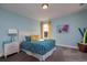 Comfortable bedroom with light blue walls, plush carpeting, and charming decor, creating a welcoming atmosphere at 760 Choctaw Dr., Conway, SC 29526