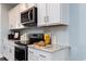 Modern kitchen with stainless appliances and stone countertops at 760 Choctaw Dr., Conway, SC 29526