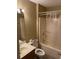 Bathroom featuring a vanity, toilet, and shower with clear curtain at 770 Charter Dr. # C4, Longs, SC 29568