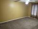 Cozy bedroom features neutral carpeting, a ceiling fan, and a window with blinds at 770 Charter Dr. # C4, Longs, SC 29568