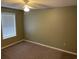 Standard bedroom with carpeted floor and a window allowing ample natural light at 770 Charter Dr. # C4, Longs, SC 29568