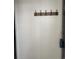 A coat rack is mounted on the wall in the entryway at 770 Charter Dr. # C4, Longs, SC 29568