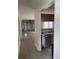 Open kitchen view with stainless steel dishwasher and pass-through to the spacious living area at 770 Charter Dr. # C4, Longs, SC 29568