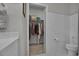 This bathroom has a walk in closet, toilet, and vanity with sink at 79 S Reindeer Rd., Surfside Beach, SC 29575