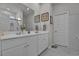 This bathroom includes double sinks, white cabinets, and modern fixtures at 79 S Reindeer Rd., Surfside Beach, SC 29575