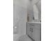 Stylish bathroom featuring elegant vanity, modern fixtures, and marble tile walls at 79 S Reindeer Rd., Surfside Beach, SC 29575