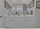 This bathroom features double sinks and a glass enclosed shower at 79 S Reindeer Rd., Surfside Beach, SC 29575