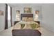Comfortable bedroom with neutral decor and large windows at 79 S Reindeer Rd., Surfside Beach, SC 29575